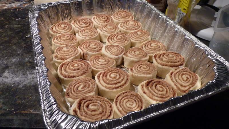 Cinnamon rolls rising in the pan